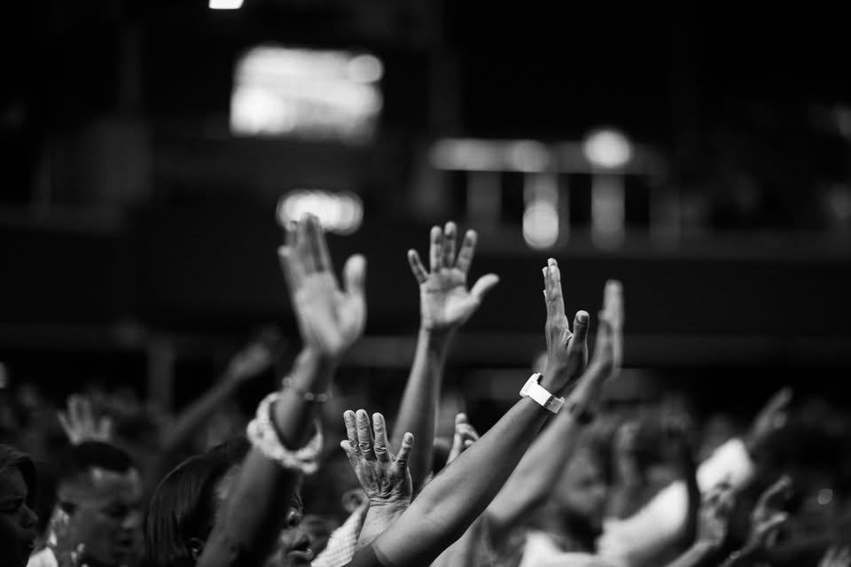 Raised hands in worship, from the ministry’s Facebook cover